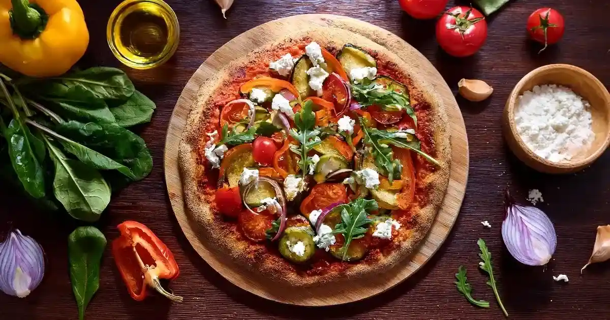 Vollkornpizza mit Gemüse, Ziegenkäse und Rucola